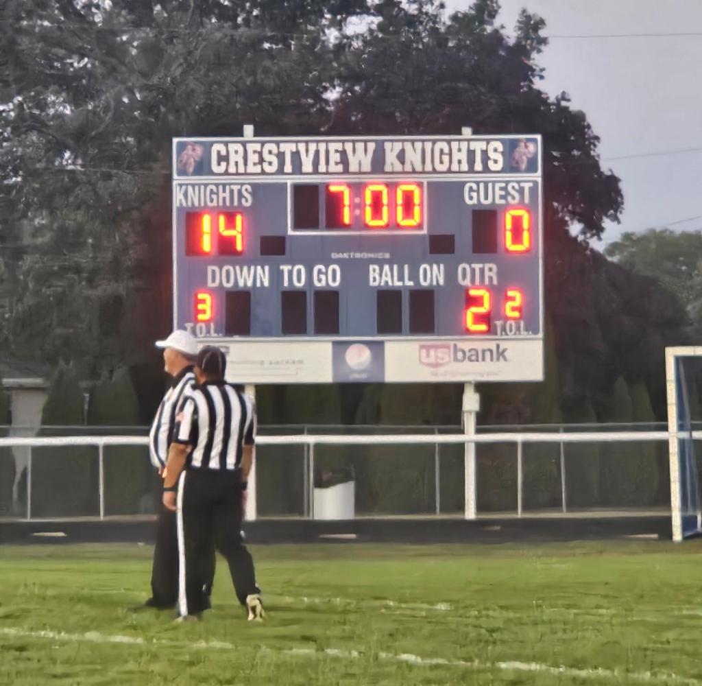 Crestview Knights football scoreboard showing Knights 14, Guest 0, with 7:00 minutes left in the second quarter.